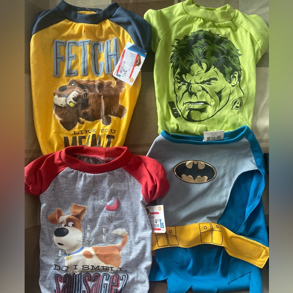 3 doggy t shirts and one Batman costume